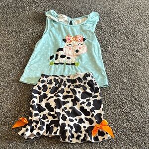 Cute Cow Print Outfit with Orange Accents